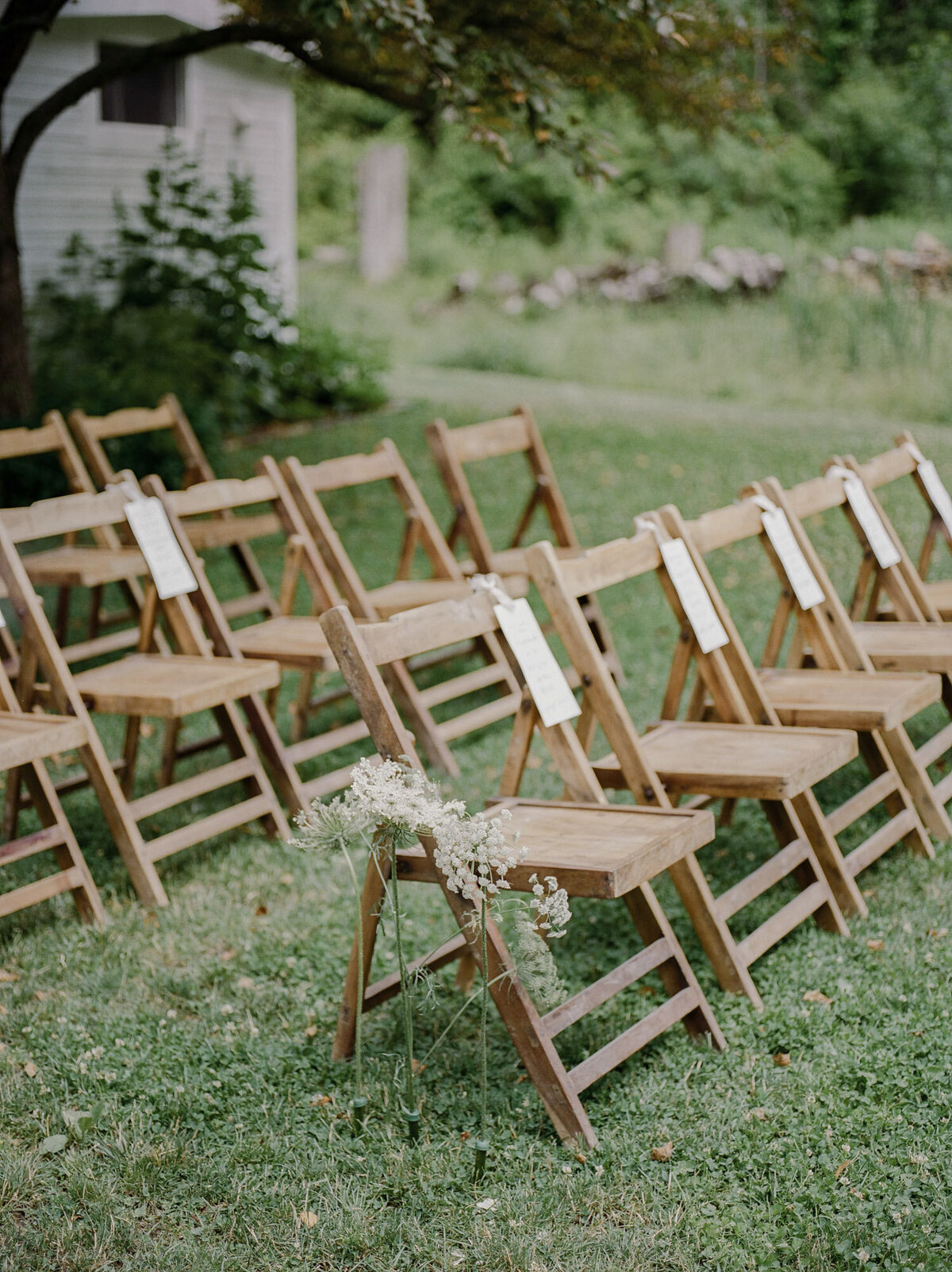 wood wedding chairs, wedding ceremony design at Glass House Community, Michigan
