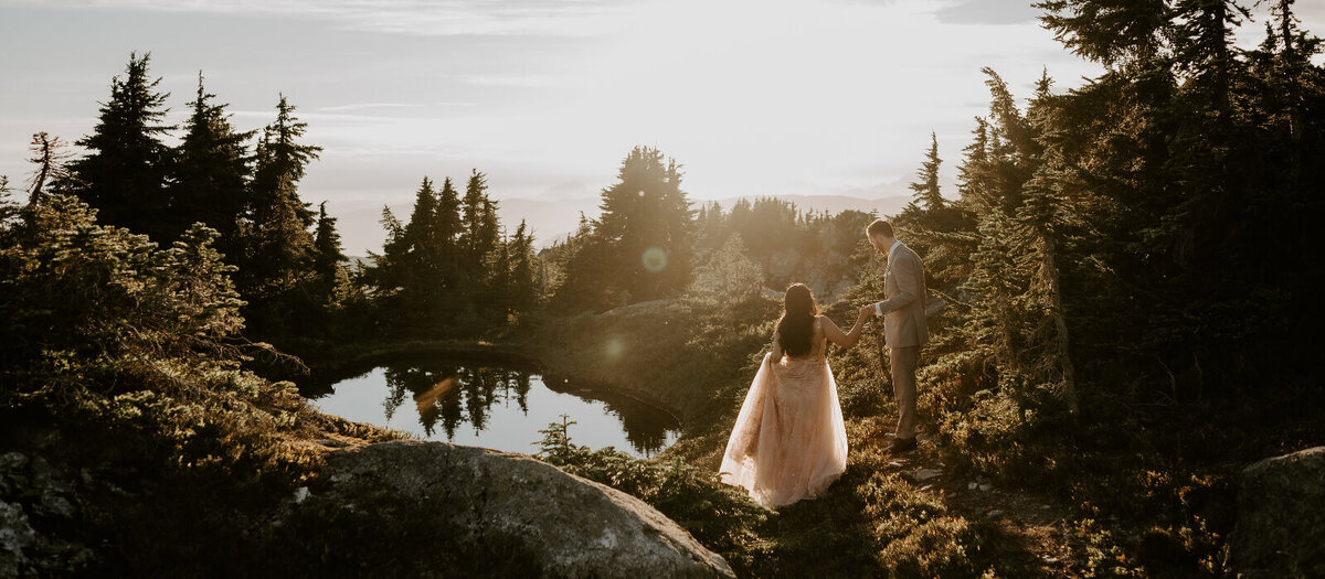 Wedding couple photographed eloping in the mountains during golden hour.