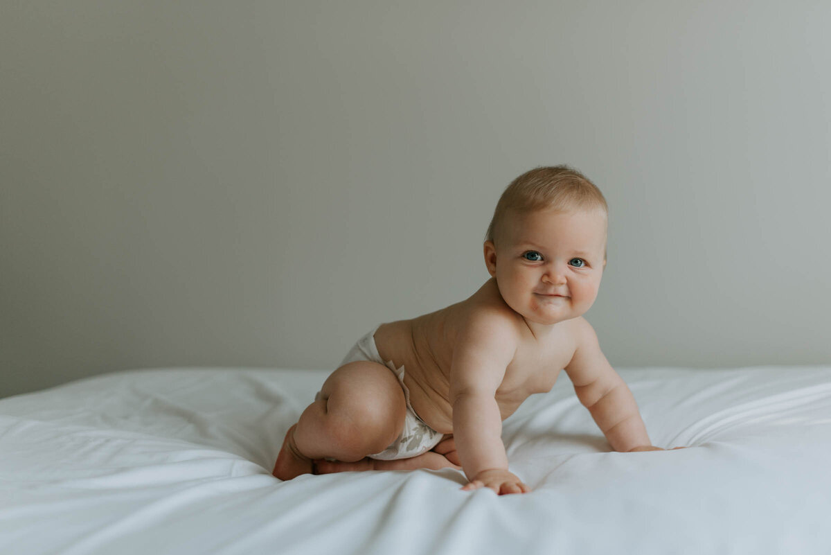 Indoor Photography baby crawling on bed simple