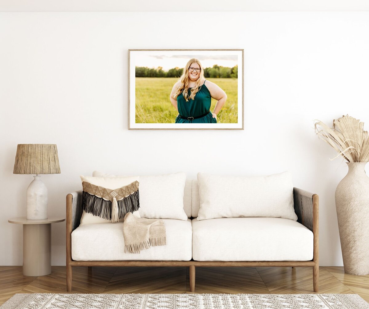 beautiful boho living room featuring a photo of a senior girl captured by Door County Photographer Ashley Kalbus