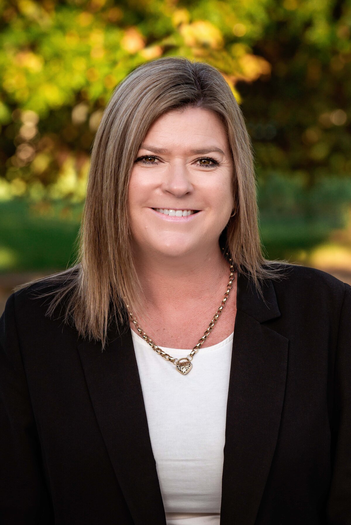 outdoor headshot of female real estate agent