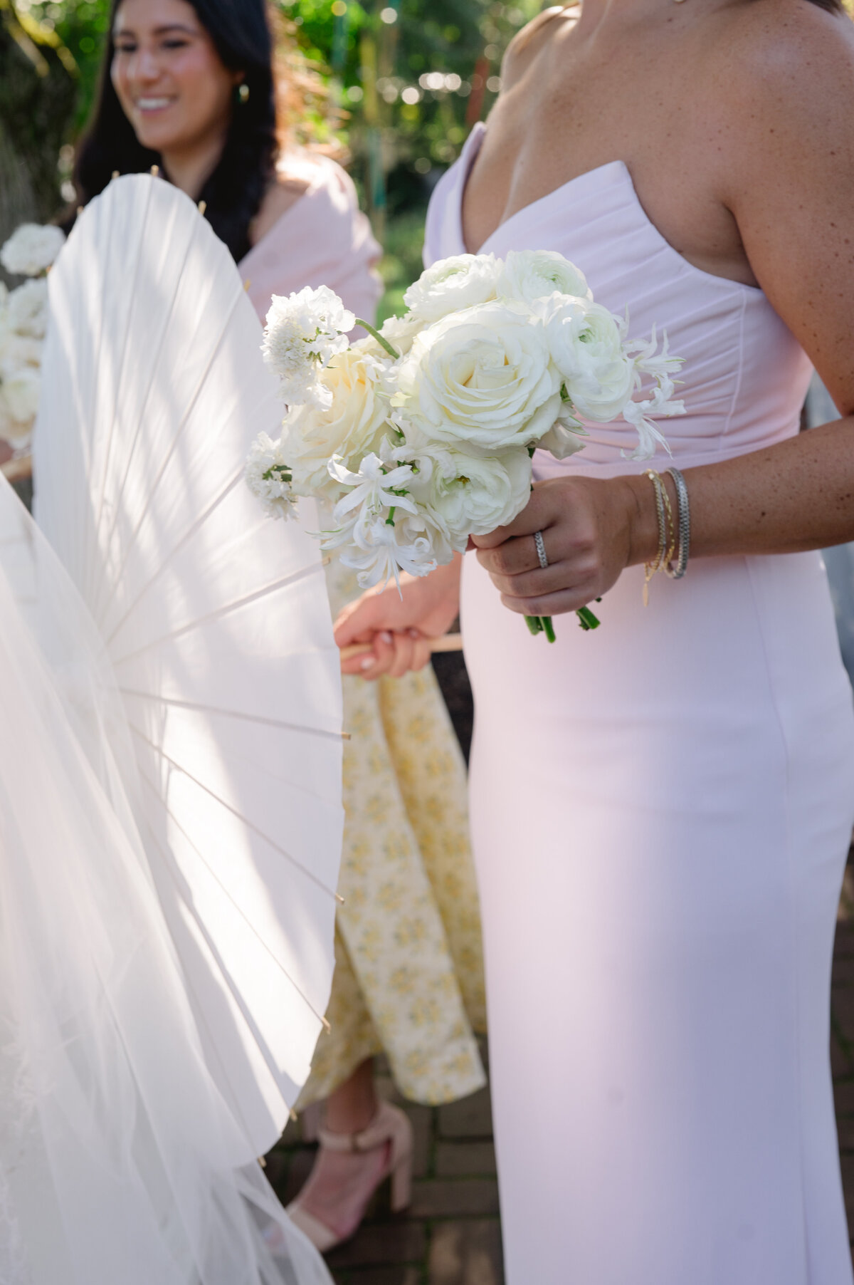 Partial view of guests at a garden wedding.