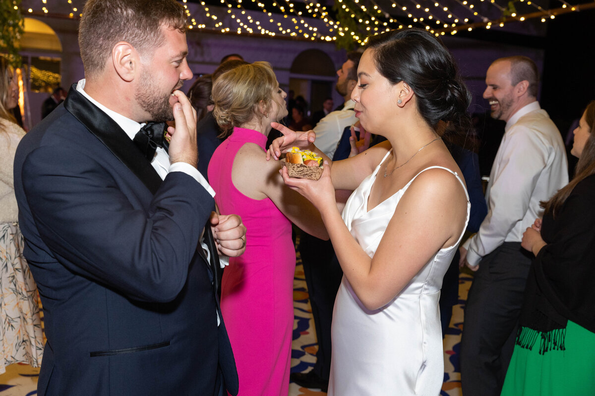 bride and groom eating