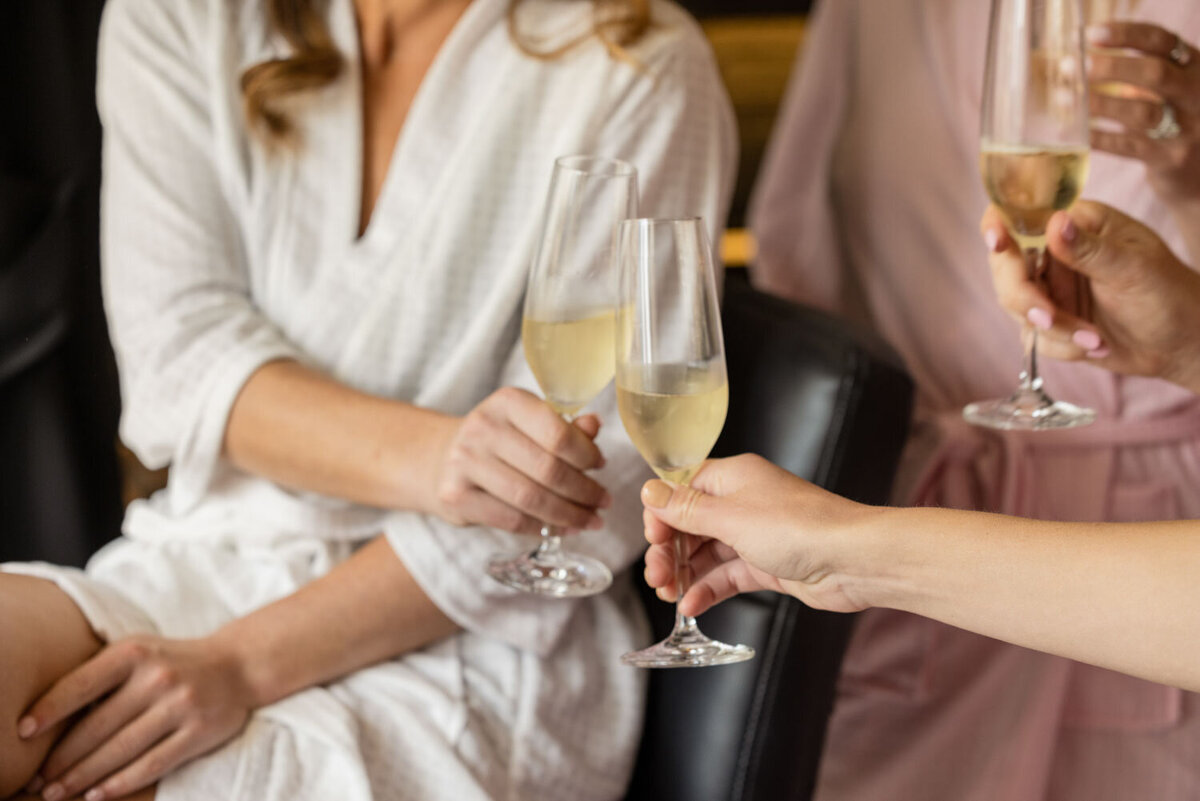 Two women toasting with champagne glasses in their hands