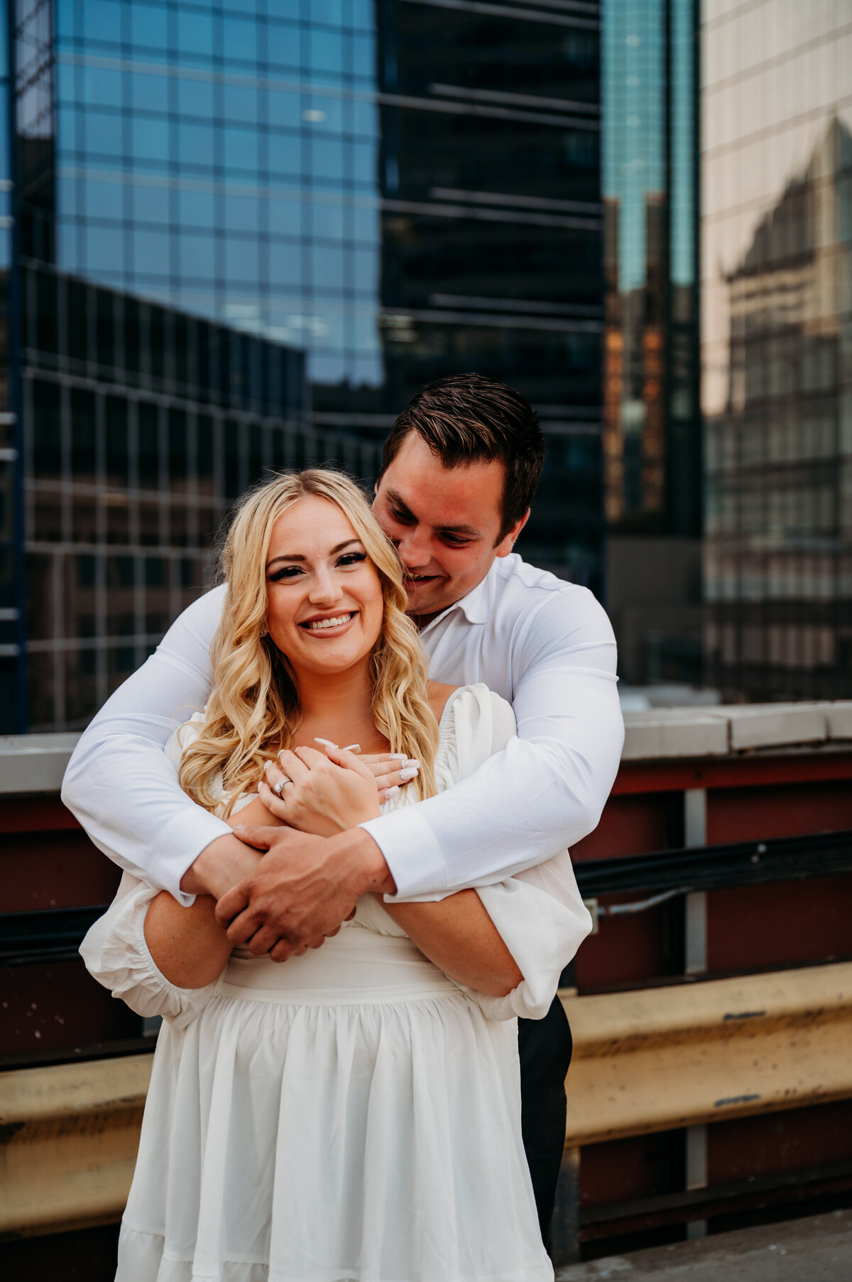 Man kissed woman on the temple while she smiles
