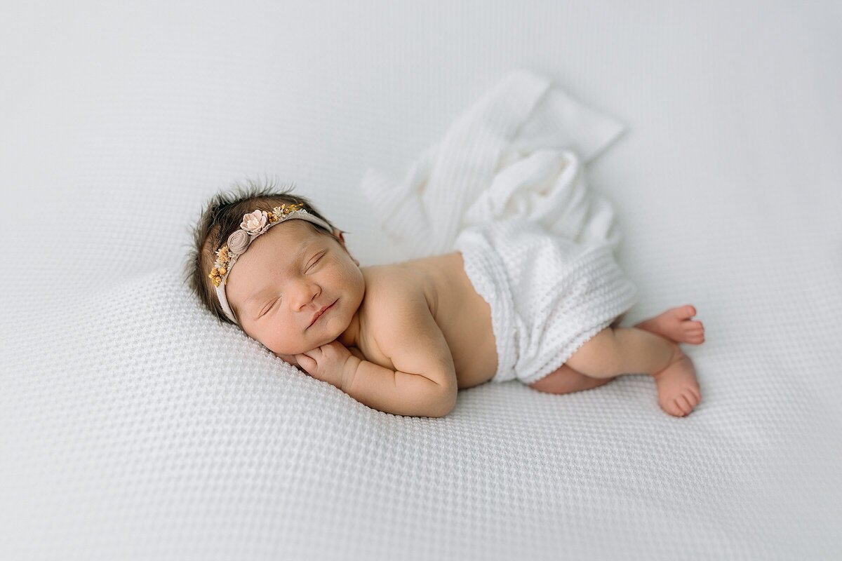 Newborn photography in Harrisonburg, VA baby on white backdrop