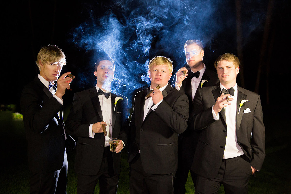 Los Willows wedding photos groomsmen with cigars smoke night shot