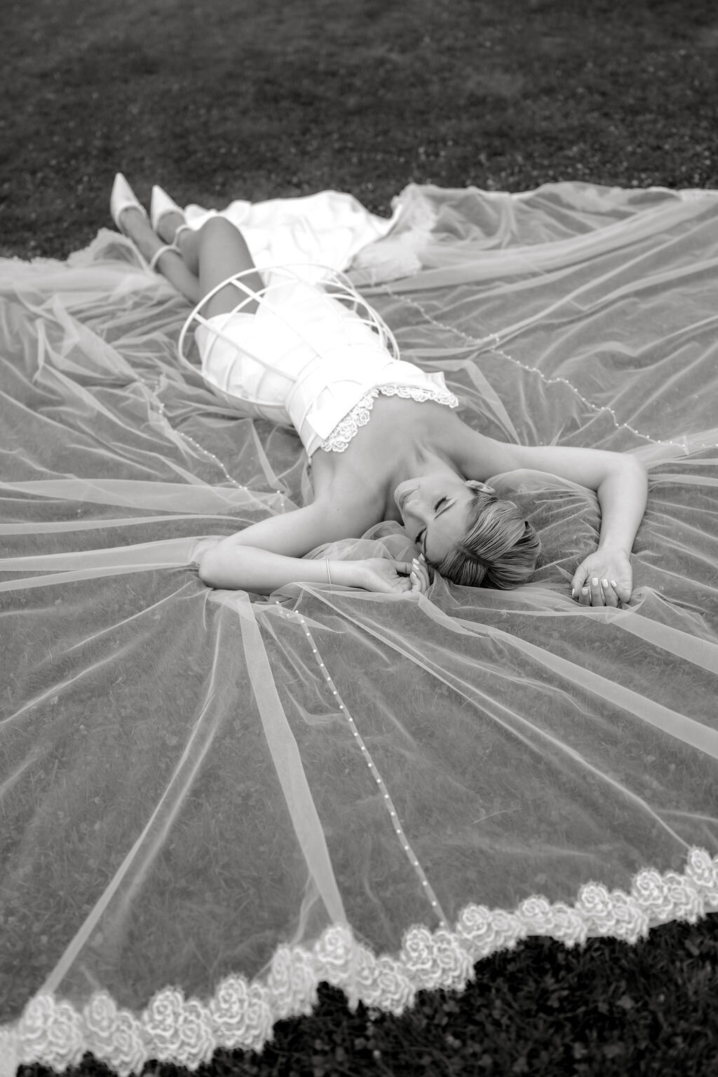 Versatile custom wedding dress with dramatic lace-edged blusher veil
