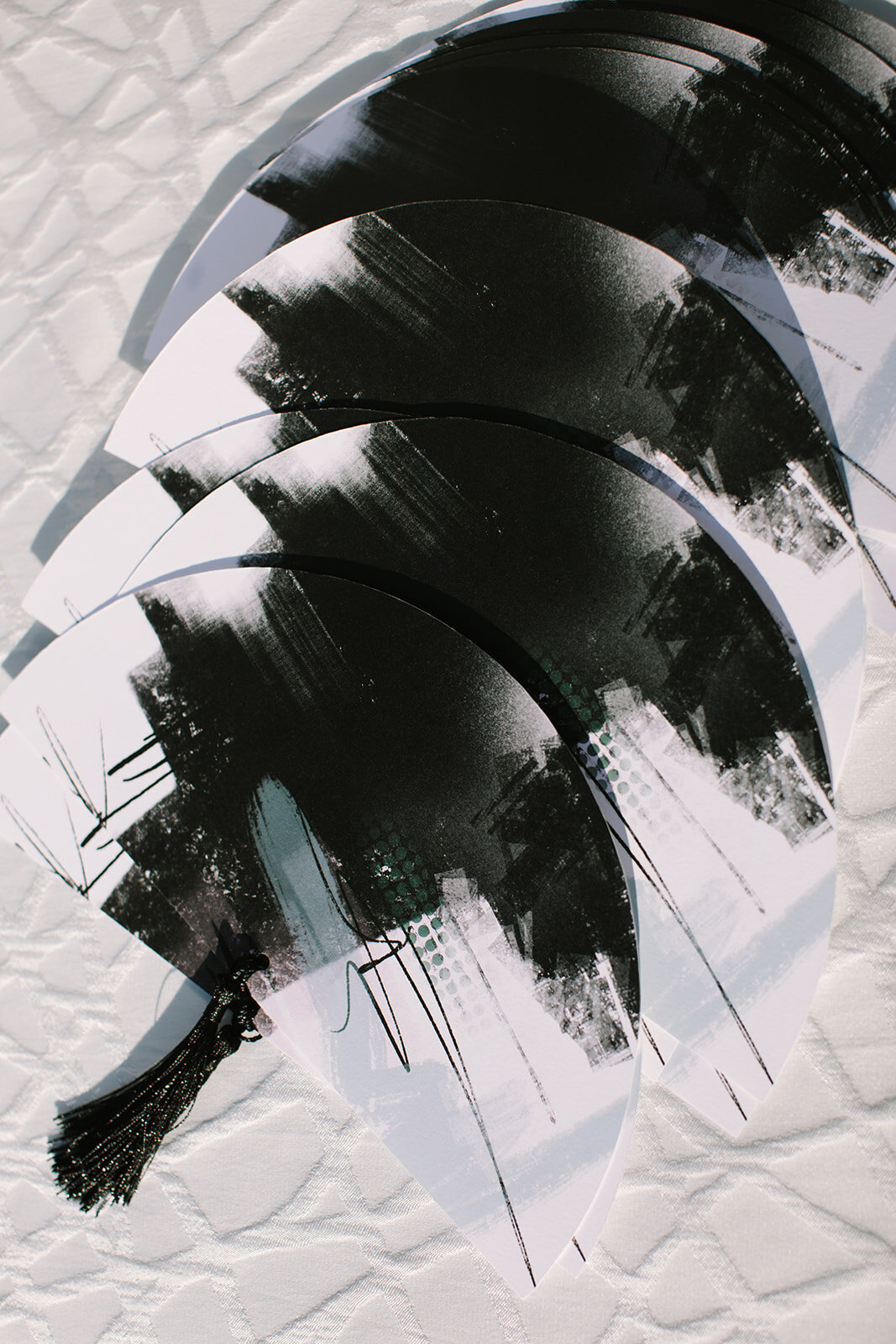 modern-black-white-desert-wedding-program-fans