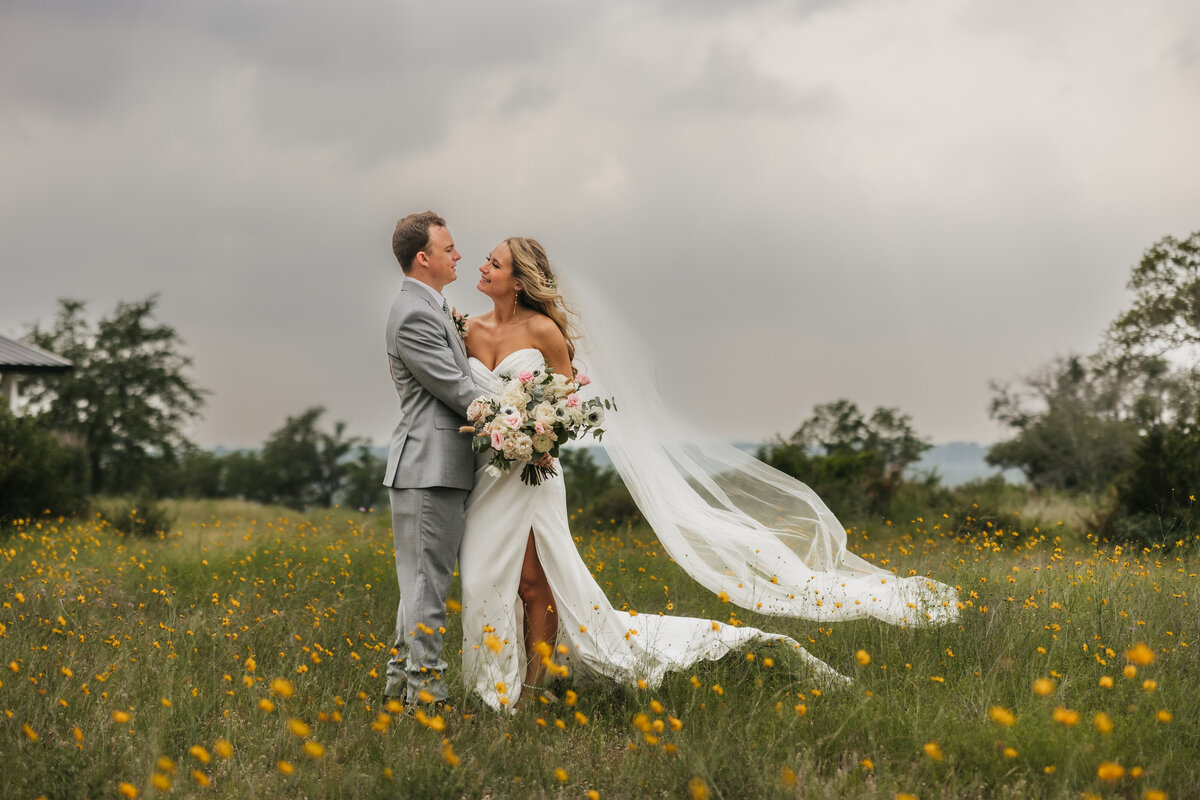 couple-with-wildflowers-maes-ridge