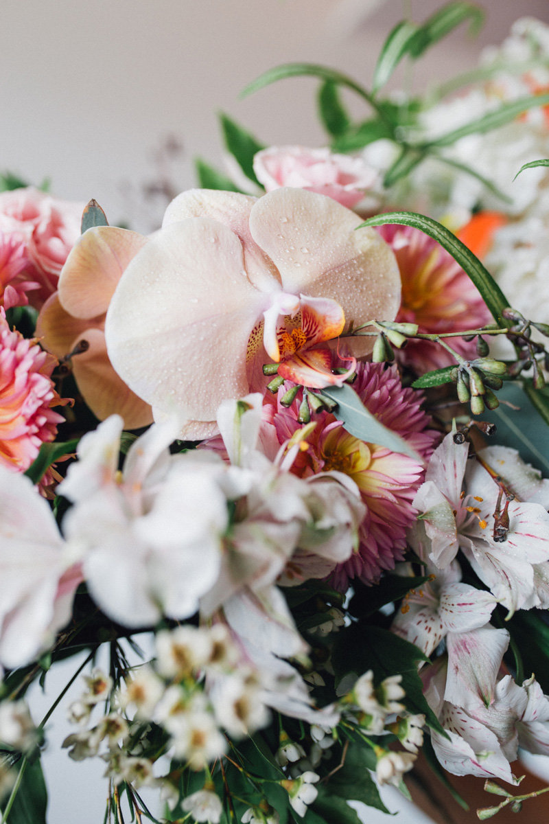 Close up of bridal bouquet peach orchids