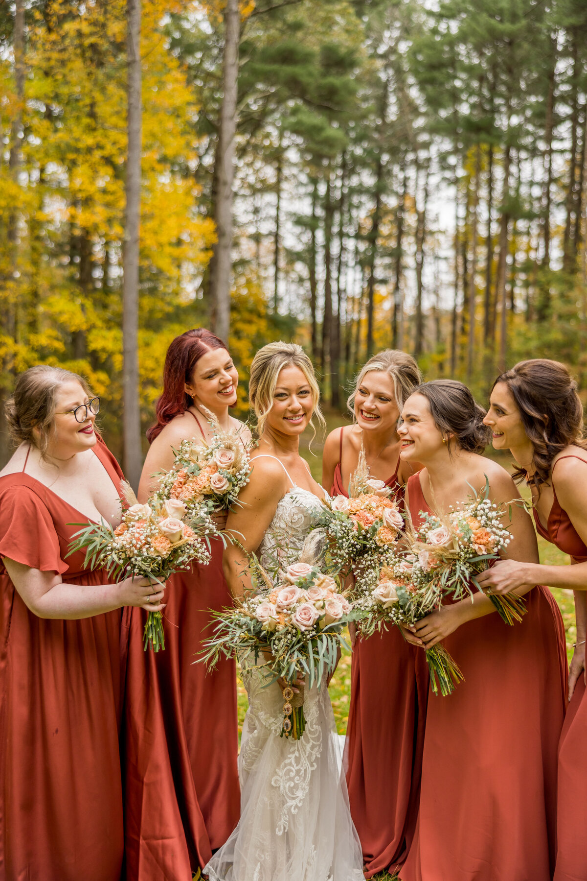 bride and bridesmaids at fall wedding