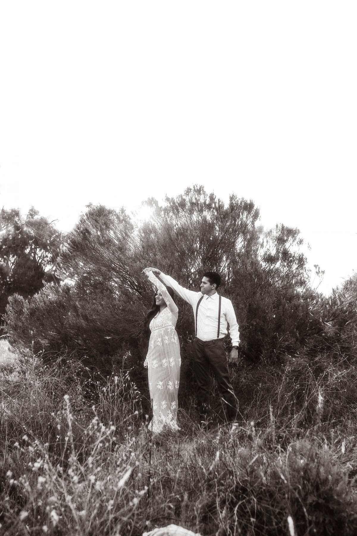 Engagement Photograph Of Woman Taking a Twirl With a Man Black And White Los Angeles