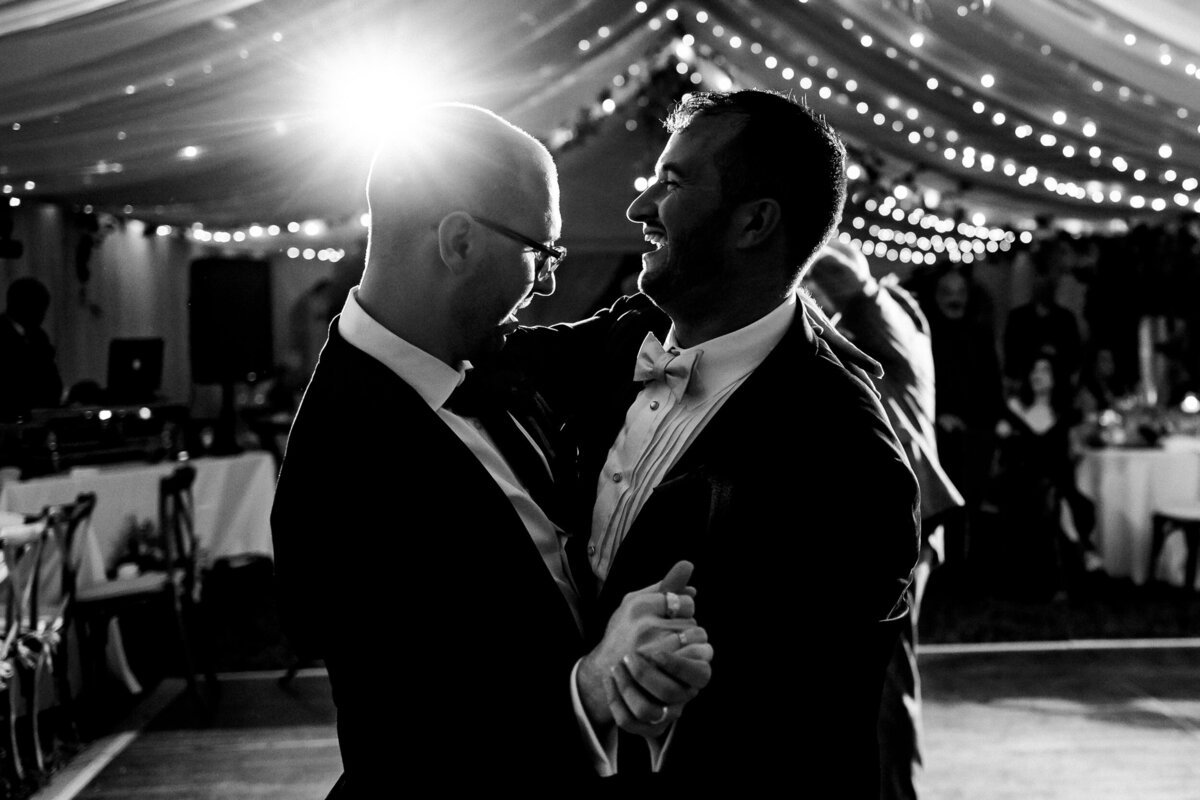 One of the top wedding photos of 2021. Taken by Adore Wedding Photography- Toledo, Ohio Wedding Photographers. This photo is of two grooms having their first dance.