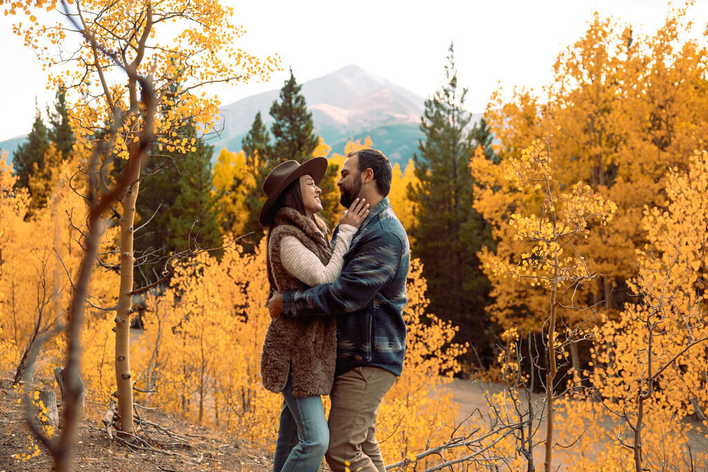 man and woman in fall foliage in breckenridge