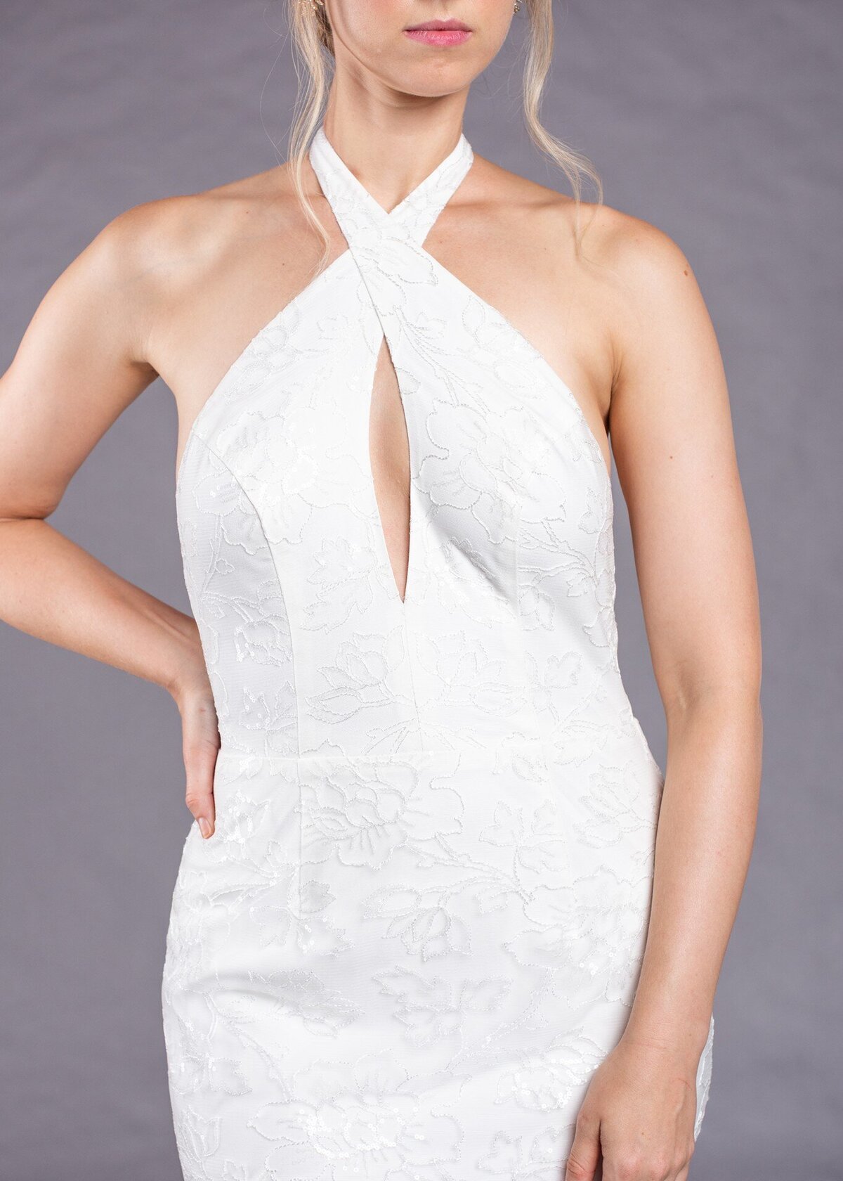 The halter neckline on the Marlene wedding dress style has a sexy keyhole detail made from the crossing of the halter straps.