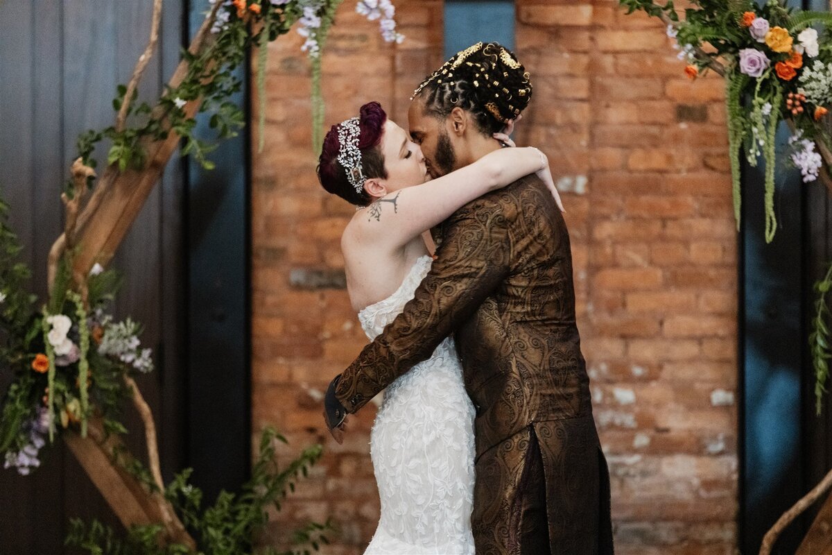 22 - Armature Works Social Room Wedding Ceremony Kiss - Tampa Bay Wedding Planner