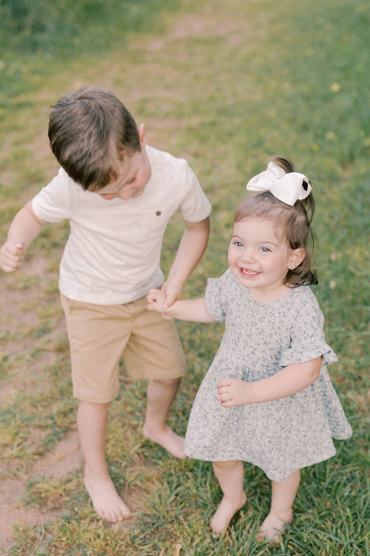 brother-and-sister-dancing-holding-hands