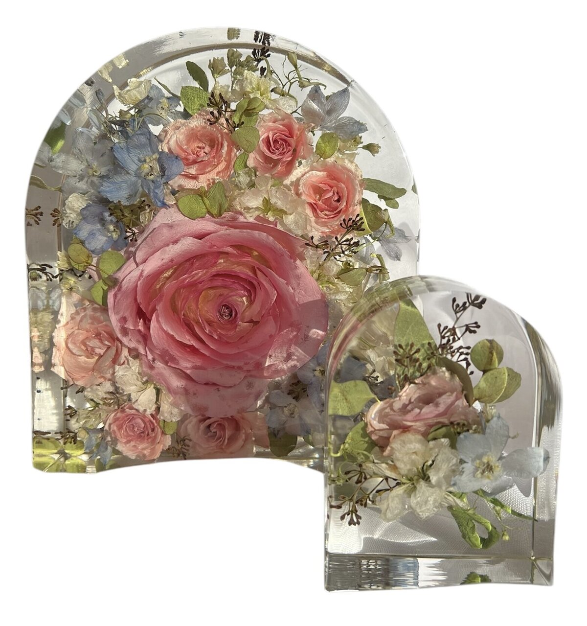 arch resin blocks with bright pink and blue wedding bouquet and grooms boutonniere preserved as a family heirloom