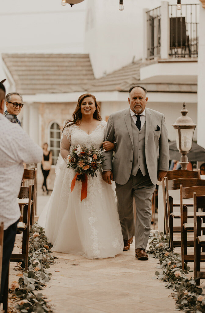 Father walks his daughter down the aisle on her wedding day