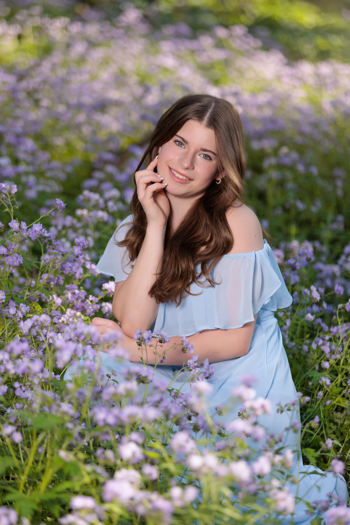 Teen in a flower field at Duke Gardens for her portraits.