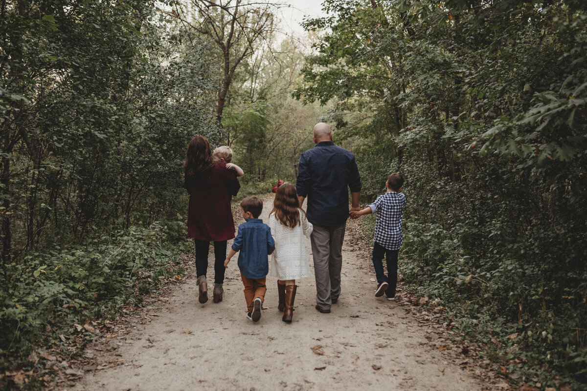 Embark on a visual journey of familial connections. Shannon Kathleen Photography captures the essence of togetherness in a serene nature preserve. Cherish your family story with timeless portraits.