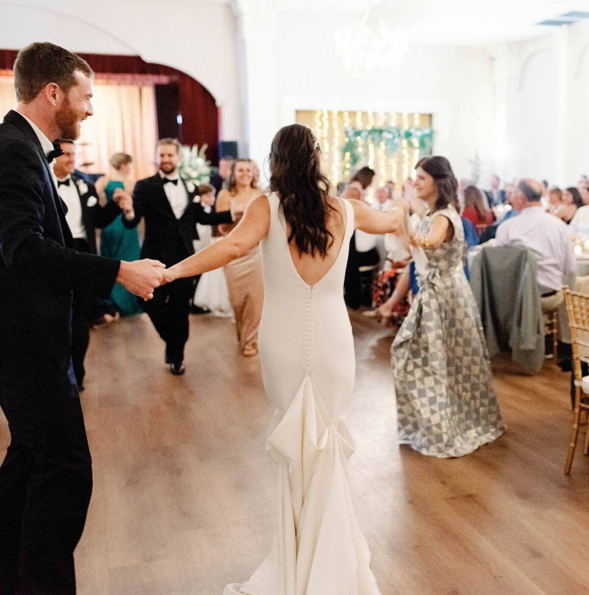 A large traditional greek dance at the reception. 