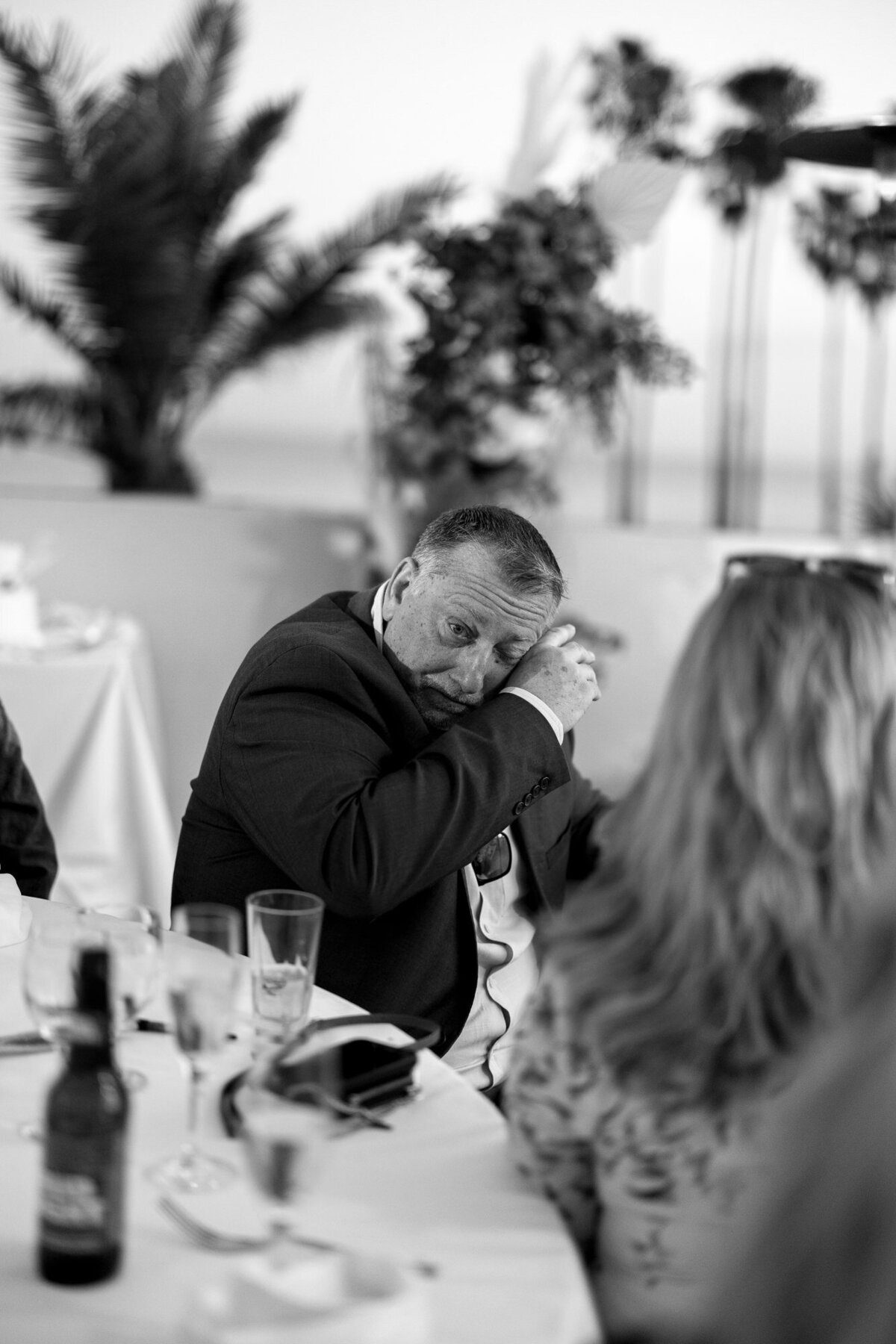 Guest wiping tear during maid of honor speech at Hilton Beachfront Resort Santa Barbara