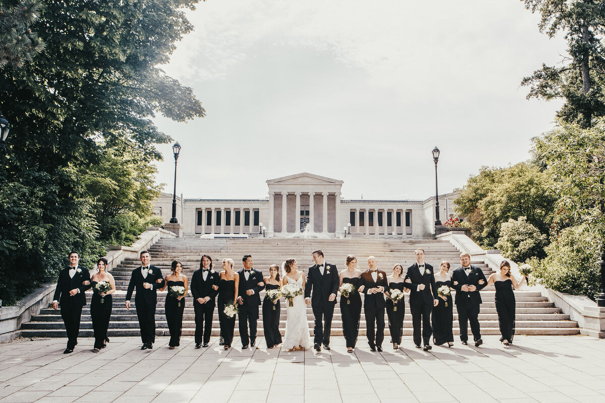 Bride, Groom and bridal party walking down stairs in Delaware Park, New York