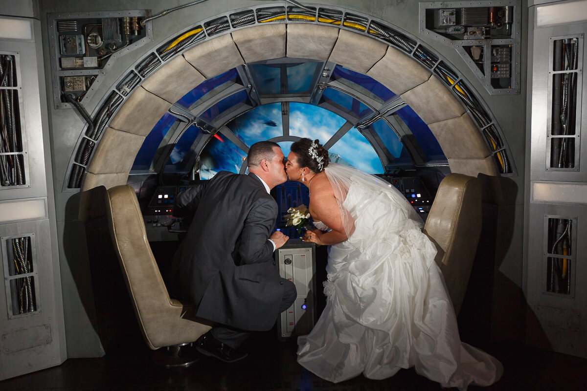 Bride and Groom kissing in the Millennium Falcon area of the Disney Dream