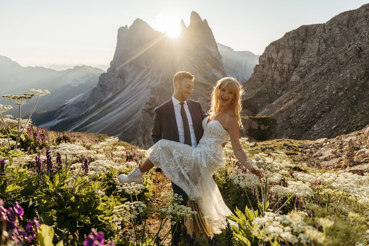 Wildflowers in foreground with bride and groom in distance