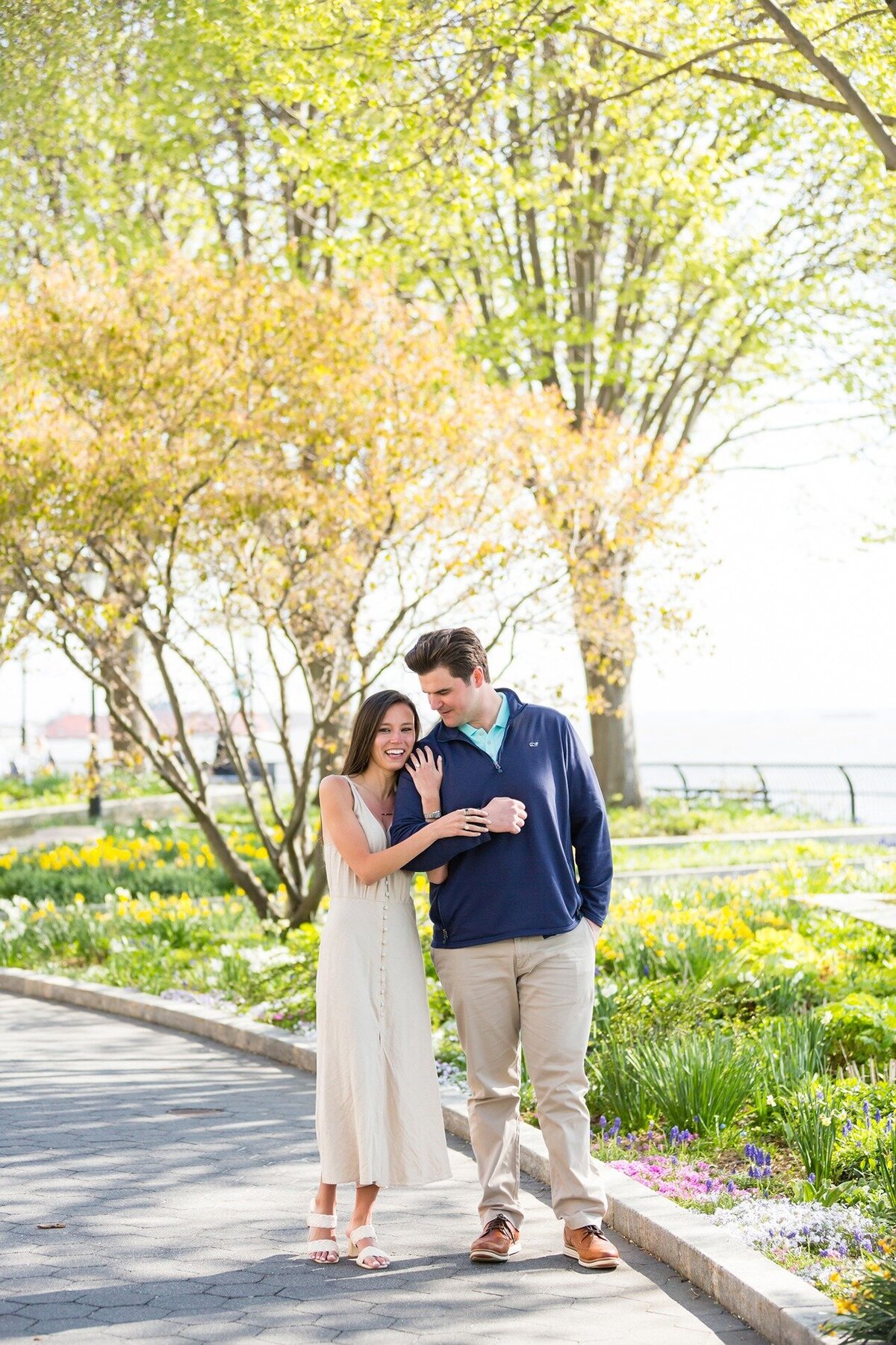 engaged-couple-walking-battery-park