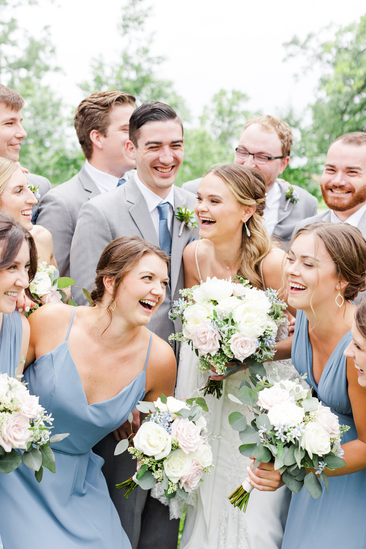 4_wedding_party_laughing_blue_bridesmaid_dresses