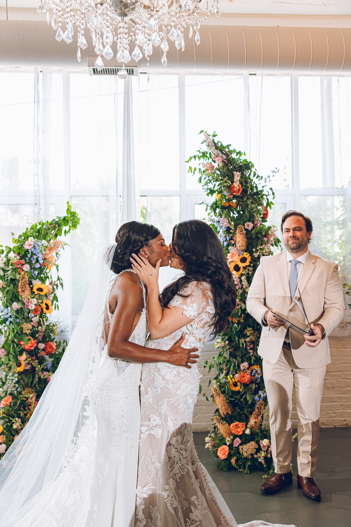 A couple shares their first kiss on their wedding day at Room 1520 in Chicago