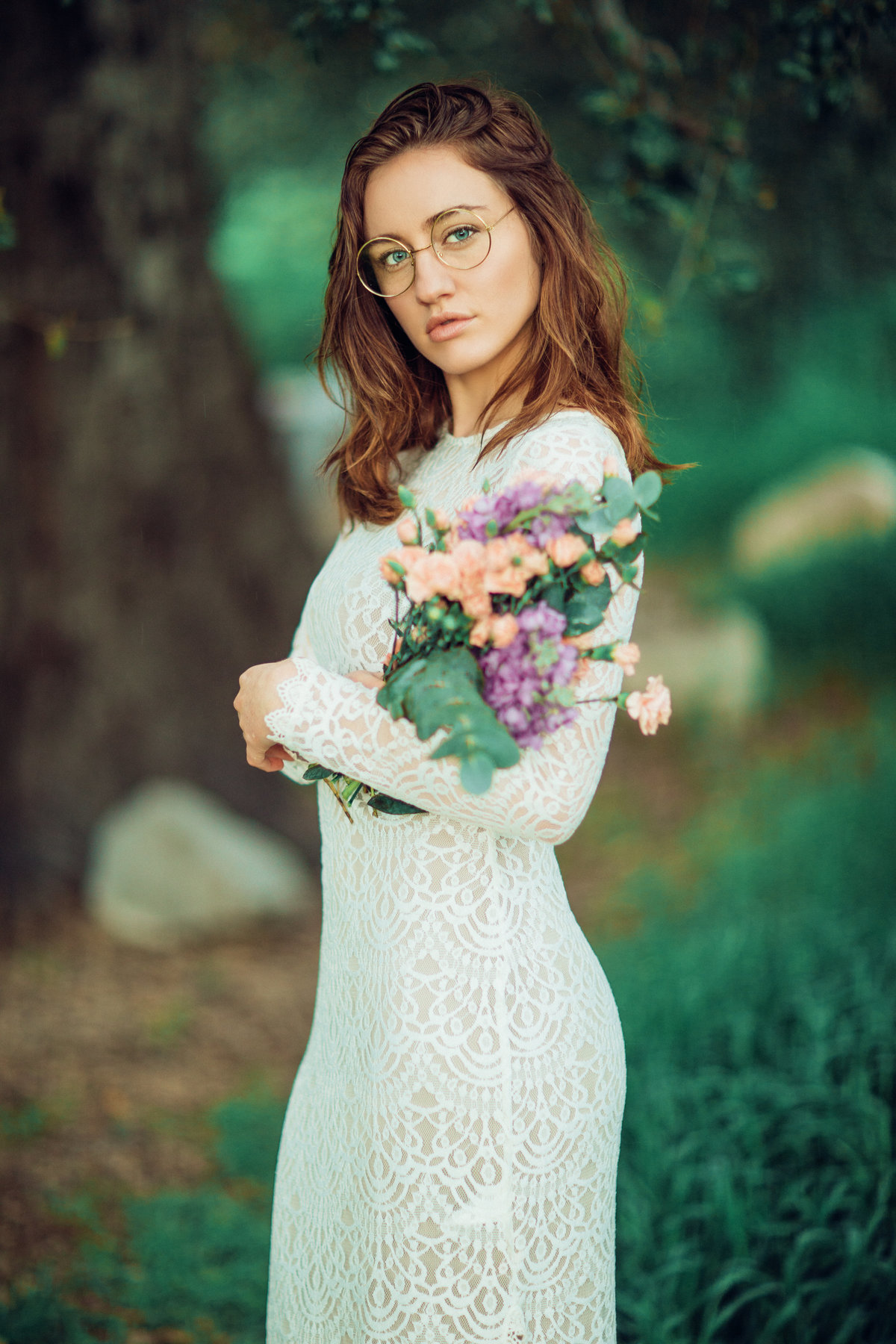 Young Woman Holding Flowers In Arms Portrait Photography