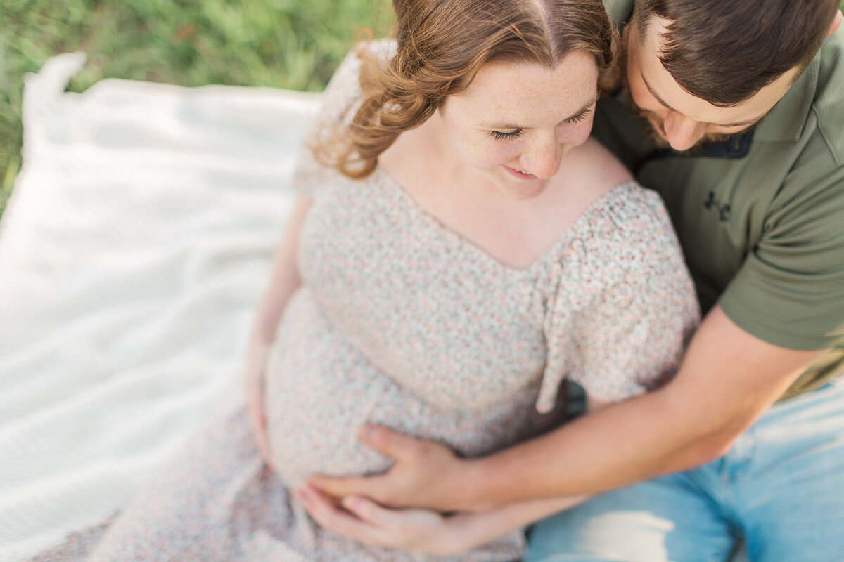 Close up angle of pregnant belly during maternity photos