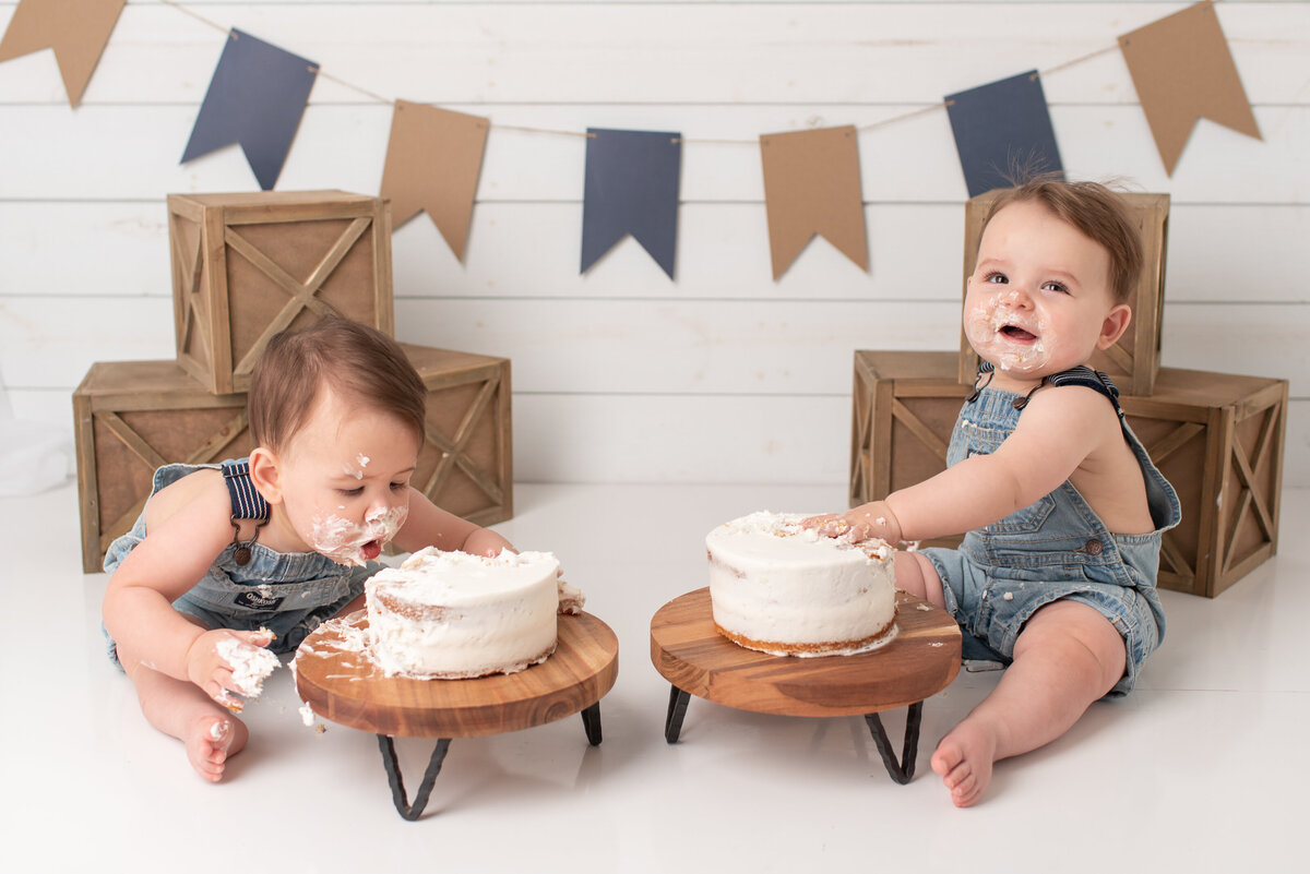 Twins eating their cake at their cake smash session