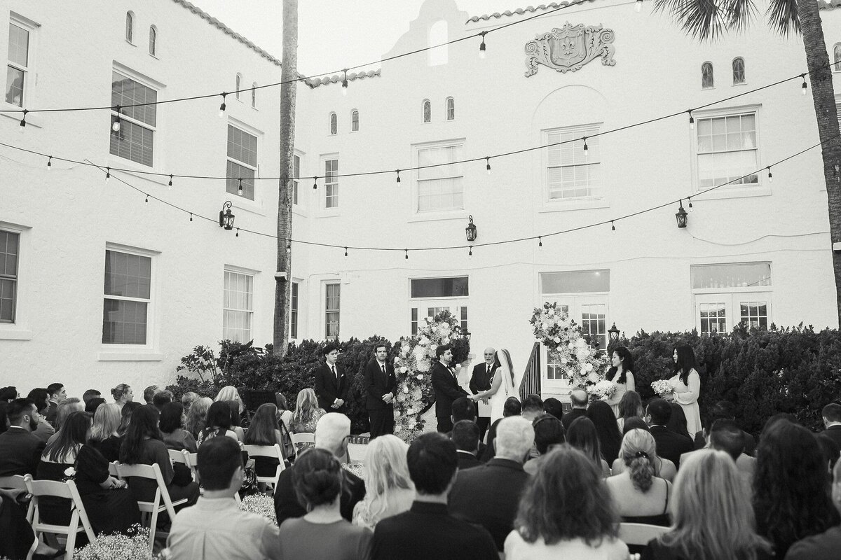 Black and white photo of wedding ceremony at Casa Marina Hotel and Restaurant, Jacksonville, FL