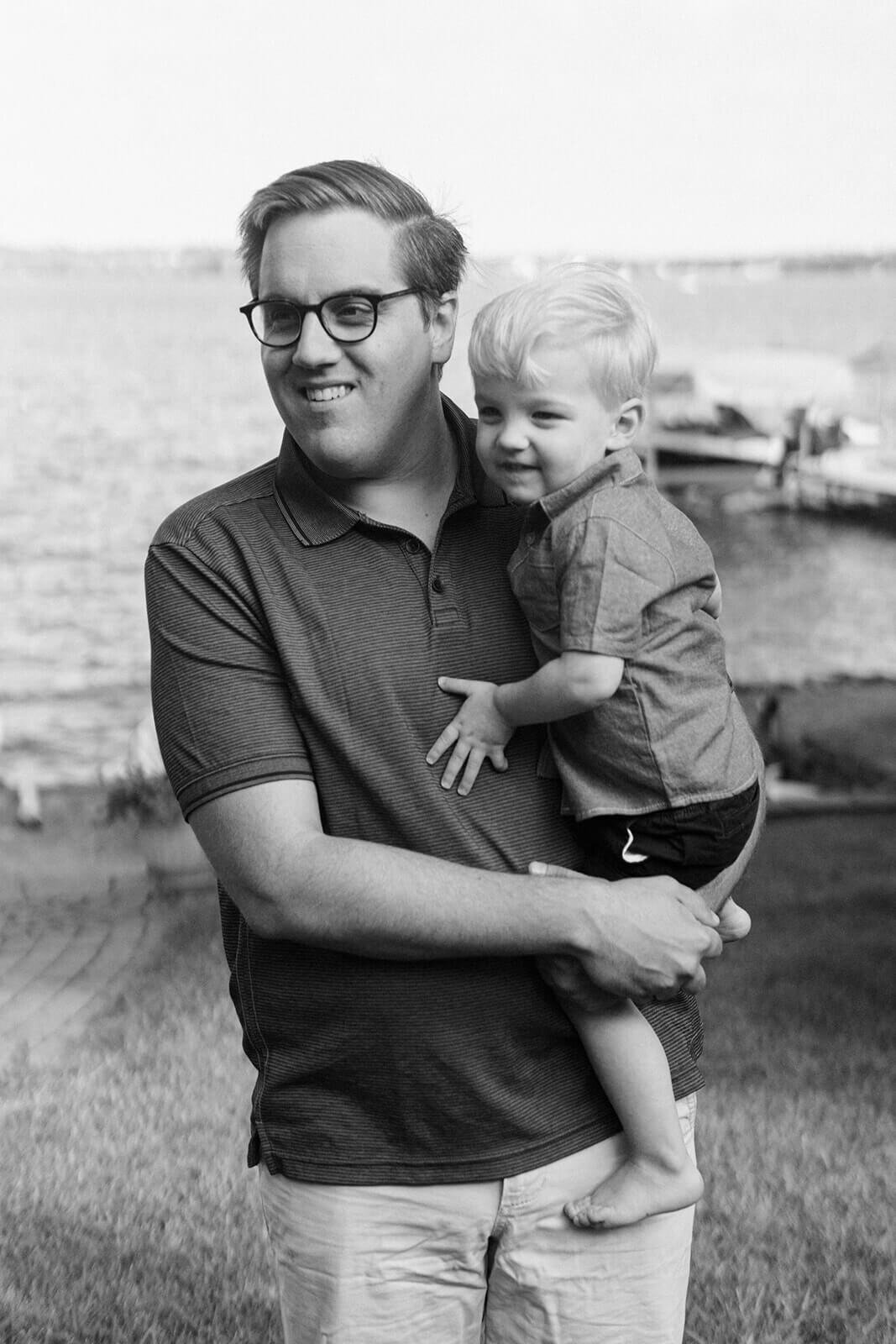 Man holding toddler at generational photoshoot in Finger Lakes, NY