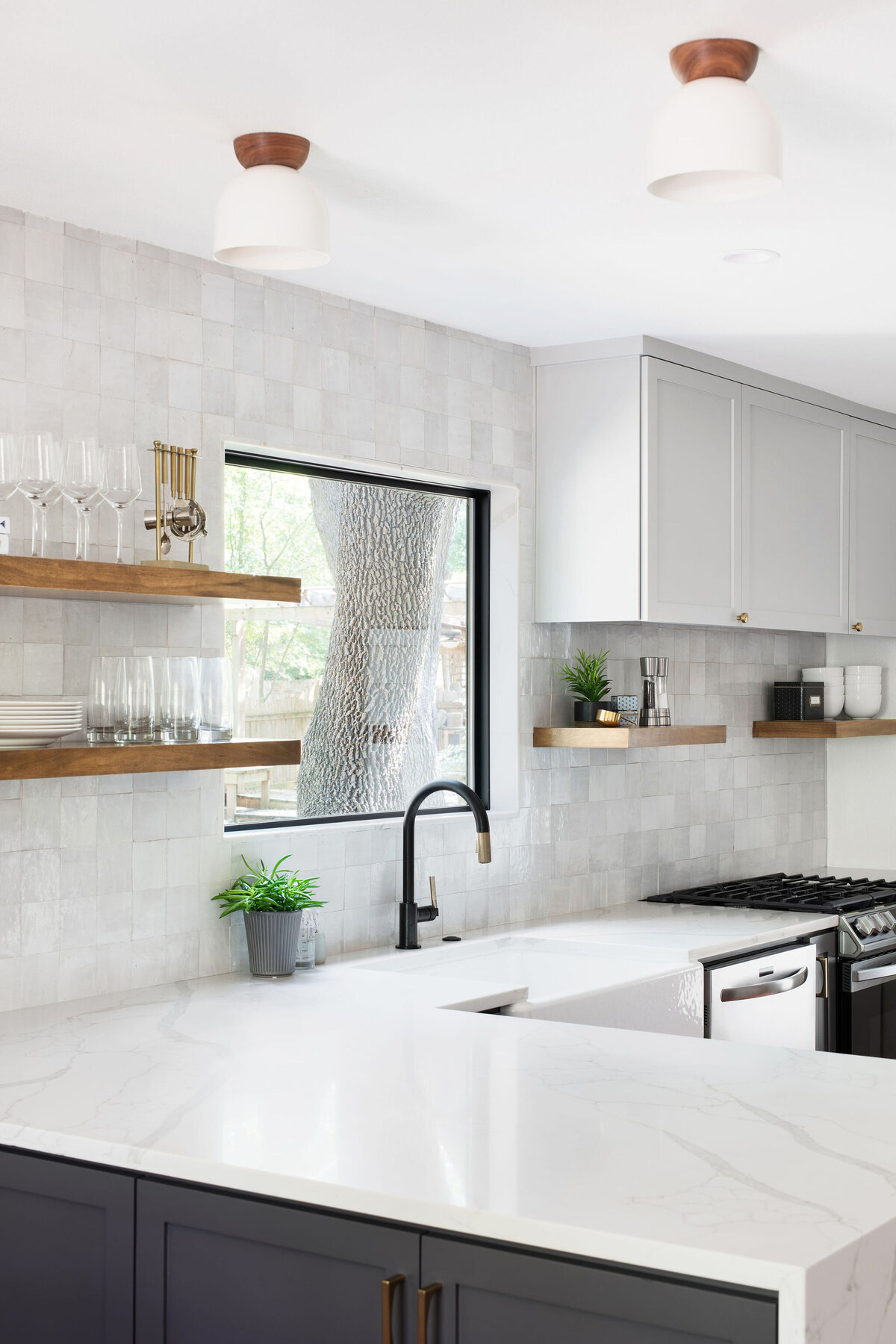 hello-home-two-tone-cabinets-kitchen-remodel-hardwood-flooring-quartz-window-jamb-zellige-backsplash-austin-14