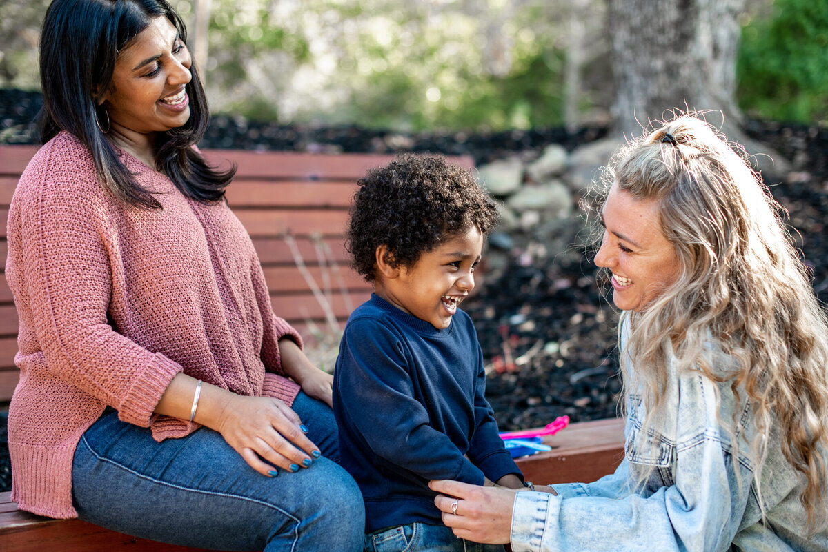 Mom and son talk to therapist during commercial photography session in Oakland, CA