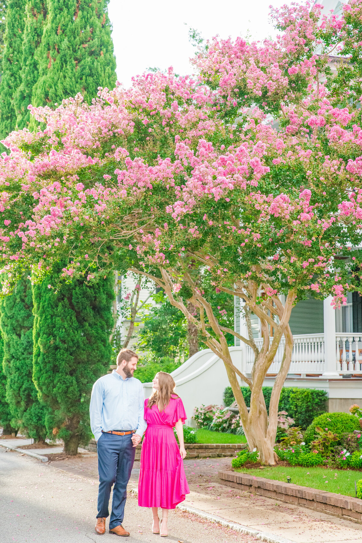 Joyful engagement session in downtown Charleston by engagement photographer Dana Cubbage