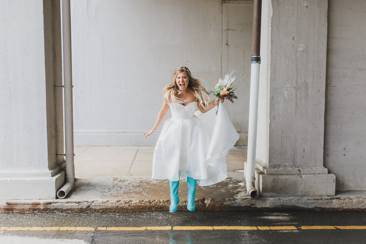 Antonia Baker Experience - bride jumping into puddle