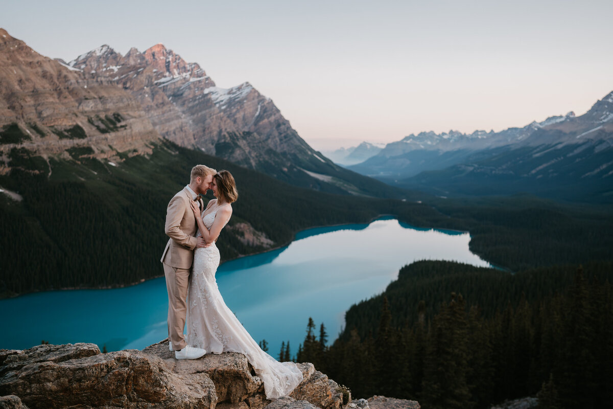 Couple holds each other during Peyto Lake elopement