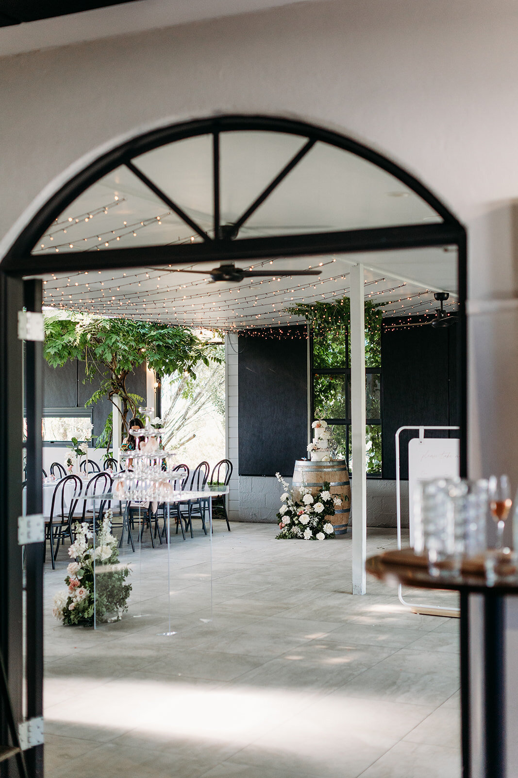 Looking through a doorway to the reception of a wedding at Brindabella Hills Winery