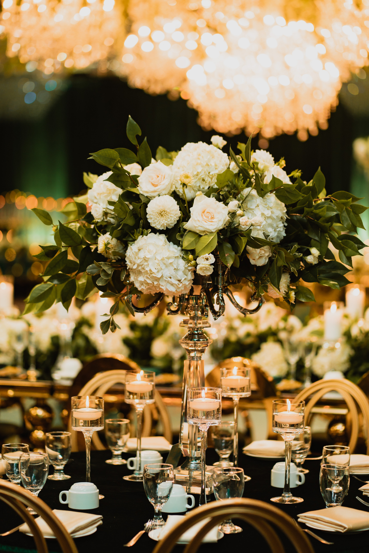 emerald-green-gold-reception-florals-centrepieces-greenery-floating-candles-roses