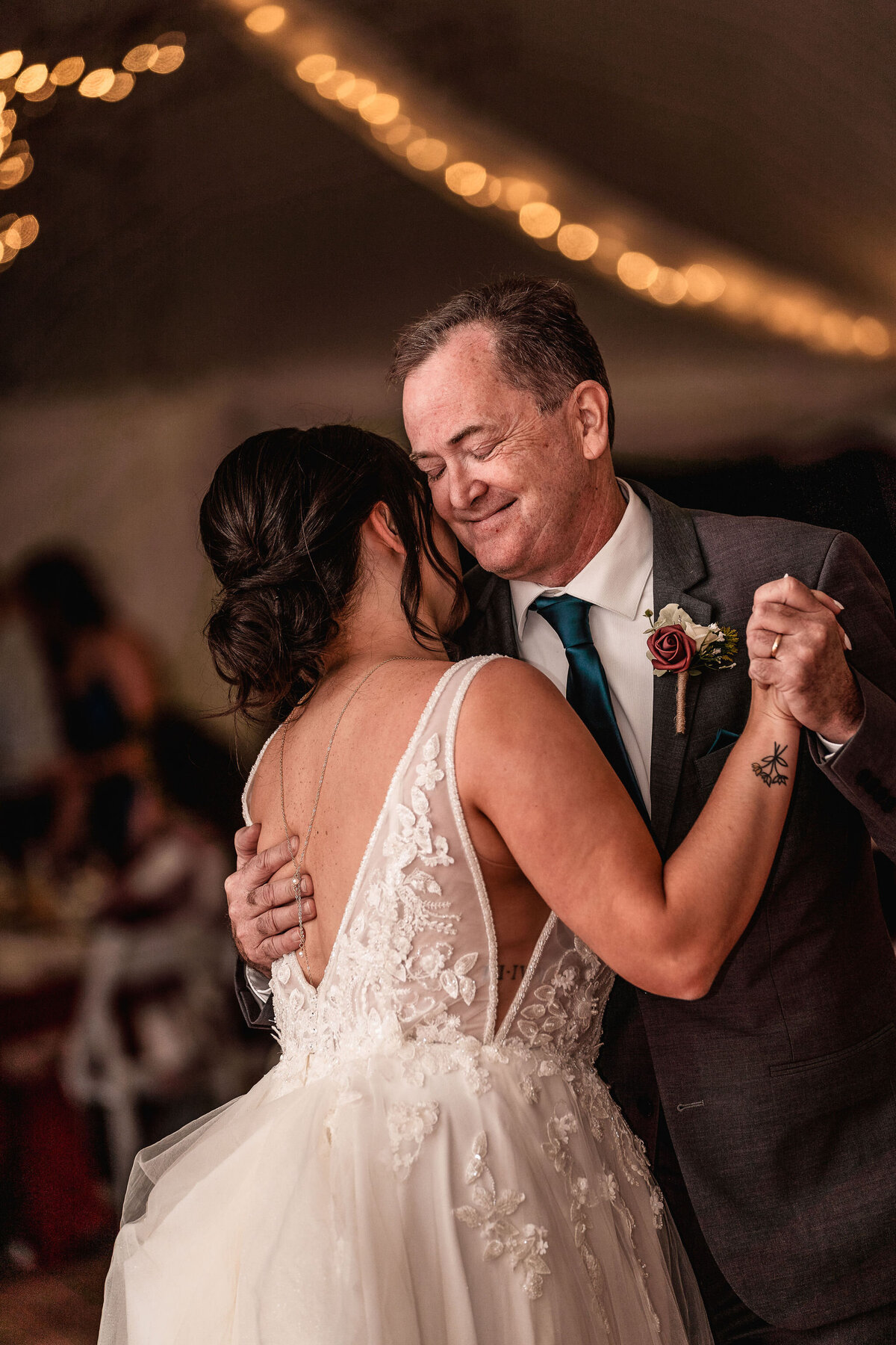 Father smiling sweetly during father daughter dance at Waterville Valley Resort wedding in white mountains NH by Lisa Smith Photography