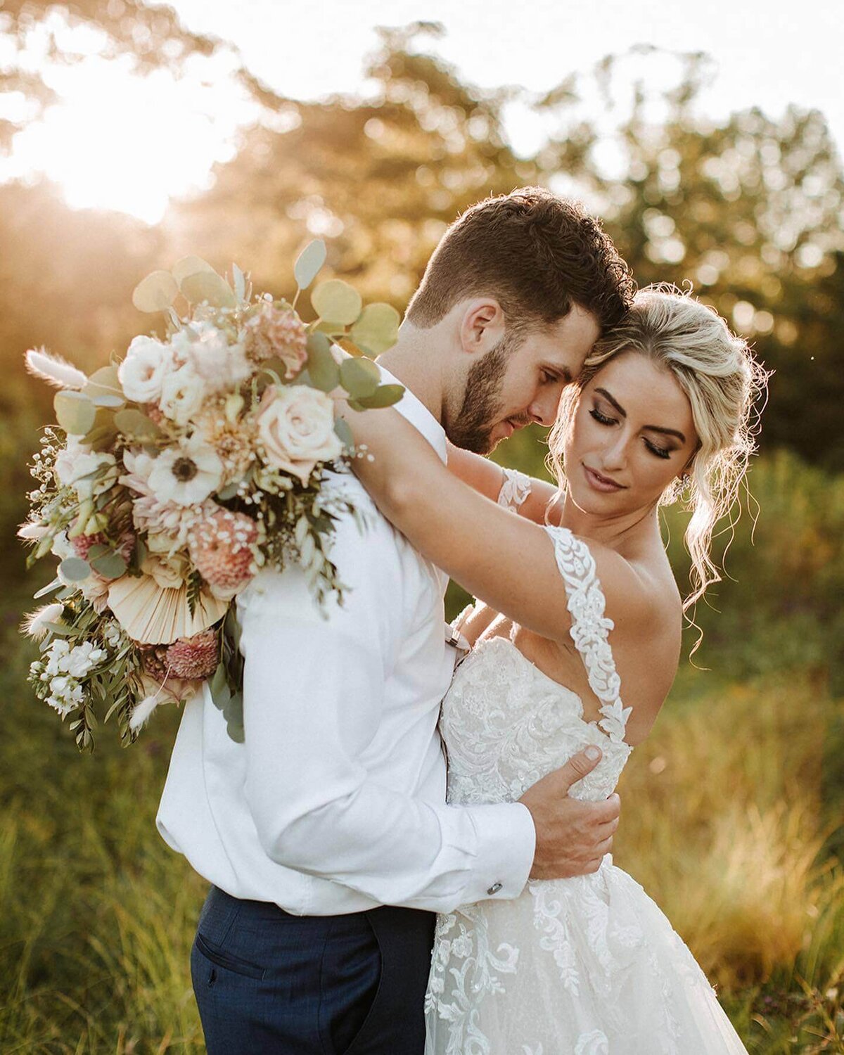 Natalie Brown wedding - bride embracing groom