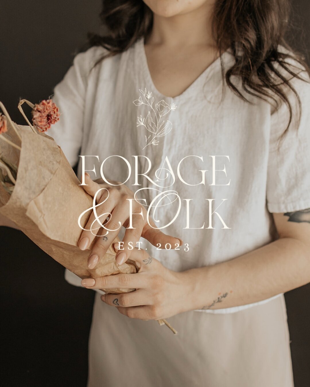 Florist holding a bouquet with a logo overlaid on them representing full service design and calligraphy by Life in Letters.