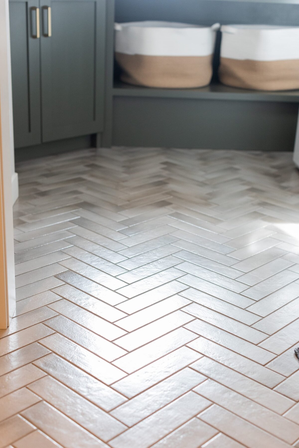 michele rosenboom design modern farmhouse herringbone style floor tile in laurdry room